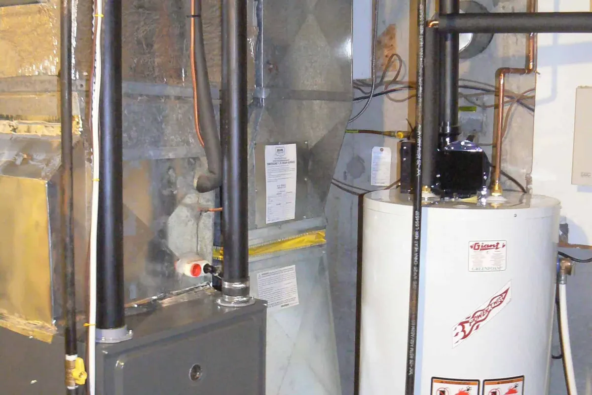 New high-efficiency gas furnace installed in a Montreal basement mechanical room