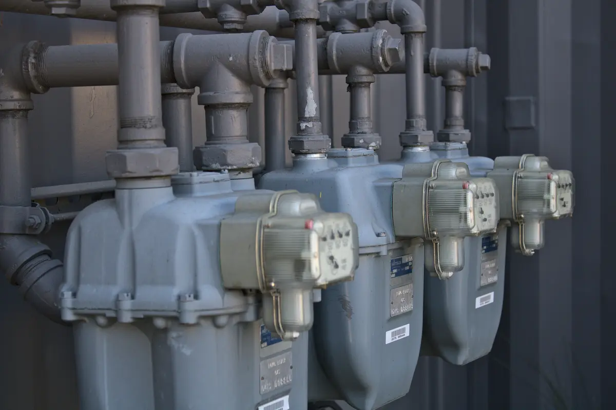 Pool heater installation with gas piping in a Montreal backyard