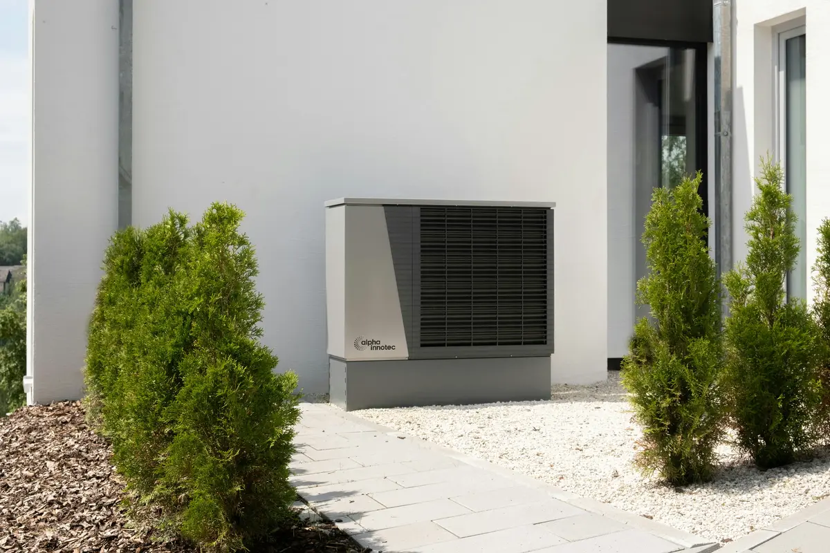 Cold-climate heat pump outdoor unit mounted on Montreal home exterior