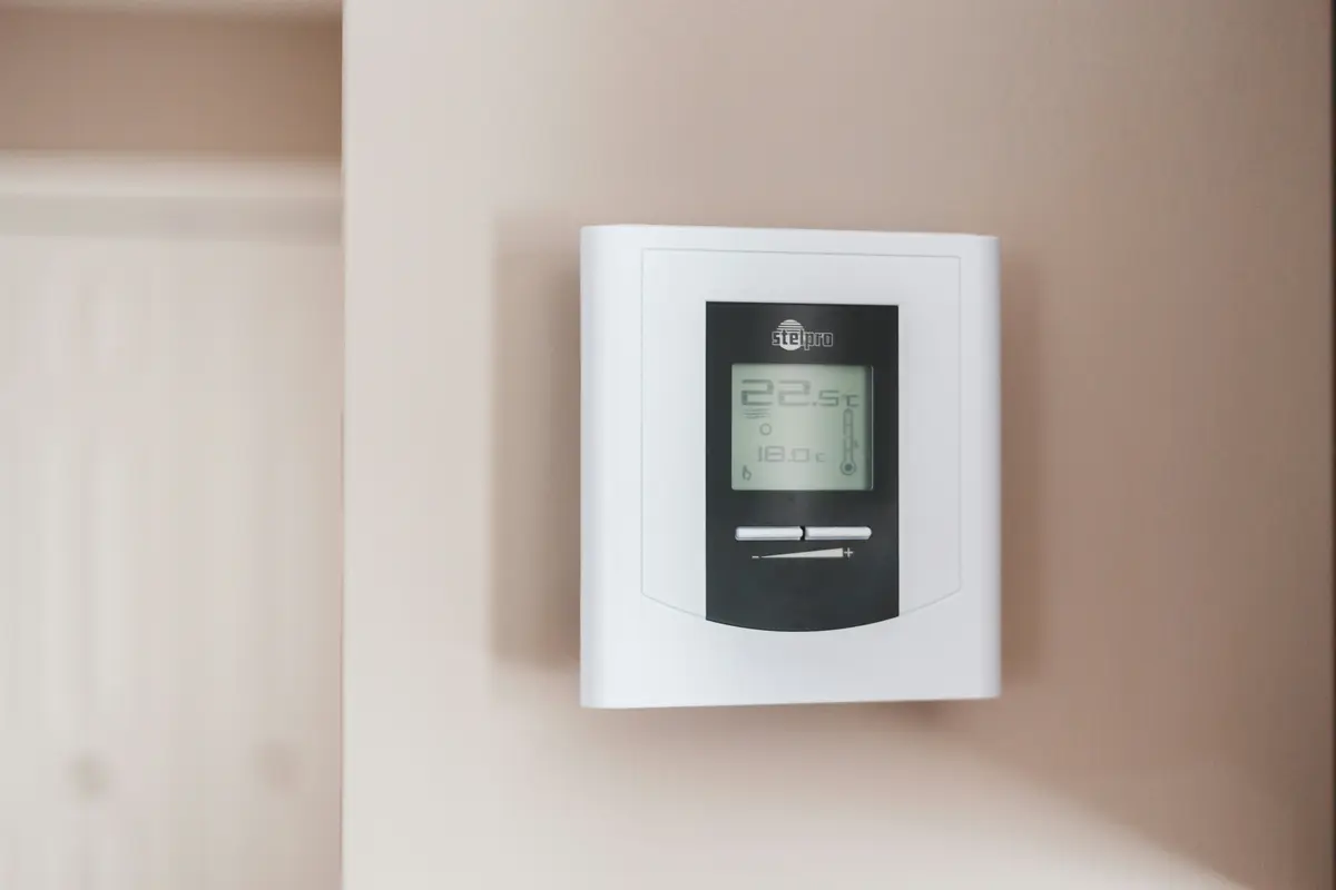 Smart thermostat installed on wall in a Montreal home