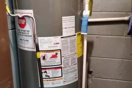 Water heater tank inspection in a Montreal home